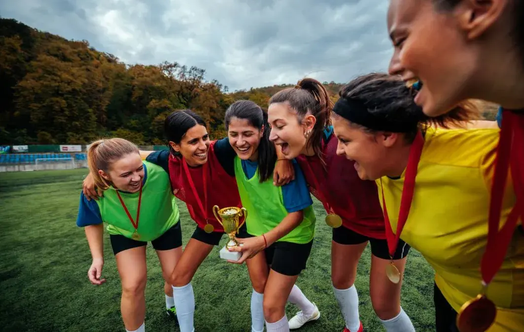 A group of club members or athletes celebrating or enjoying upgraded facilities